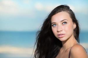 Portrait of thoughtful young brunette photo