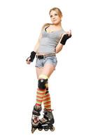 Beautiful young blonde on roller skates photo