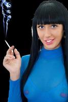 Portrait of the smiling woman with a cigarette photo