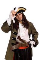 Portrait of young man in a pirate costume photo