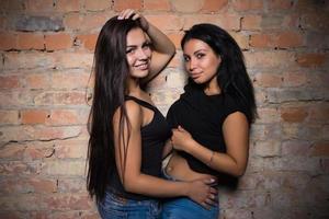 Two smiling brunettes photo