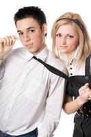 Portrait of smiling playful student pair. Isolated photo