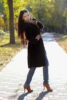 Young woman standing on road photo