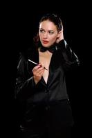 Elegant young woman with cigarette photo