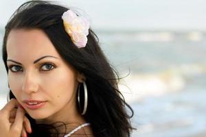 lovely young woman on the beach photo