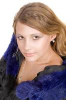 Portrait of the beauty young woman in a fur coat photo