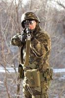 Portrait of soldier with a gun photo