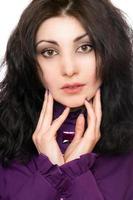 Portrait of lovely young woman in a purple jacket photo