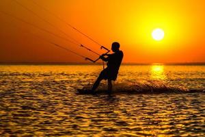 Silhouette of a kitesurfer photo