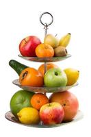 Varied fruit in vase photo