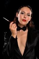 elegant young brunette with cigarette photo