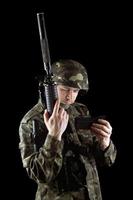 Soldier changing magazine of m16 photo