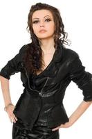 Portrait of perfect young brunette in black clothes. Isolated photo