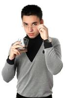 Young man with a glass. Isolated photo