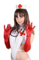 Portrait of the sexy nurse with a stethoscope. Isolated photo