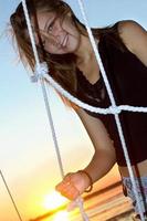 smiling teen girl at sunset photo