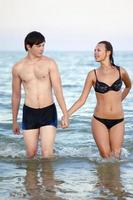 Young couple on the beach photo