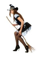Attractive young woman with a besom photo