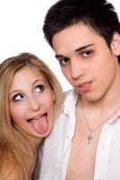 Young man and funny girl. Isolated photo