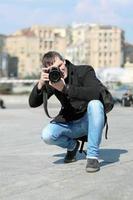 Young man with camera photo