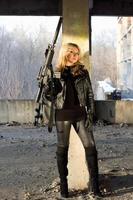 Dangerous young woman with rifle photo