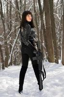 Beautiful young woman with a rifle photo