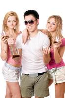 Two attractive blonde woman and young man photo