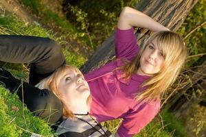 Two happy beauty young blonde outdoors photo