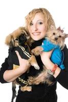 Portrait of smiling pretty blonde with two dogs. Isolated photo