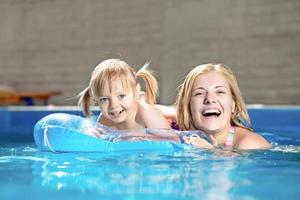 Attractive little girl and her mother photo