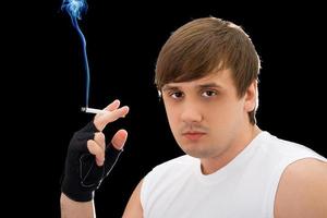 Portrait of the young man with a cigarette photo