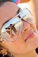 Reflexion of the photographer in model glasses photo