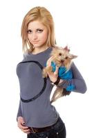 Pretty blonde posing with puppy. Isolated photo