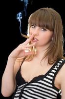 Portrait of the young woman with a cigar. Isolated photo