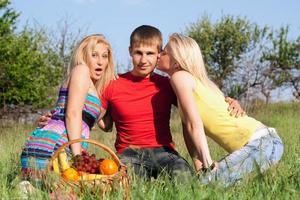 Two beautiful blonde and young man photo