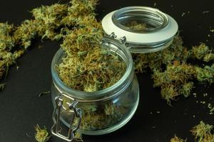 Legal commercial cannabis business online. Delivery of marijuana, weed in jar photo