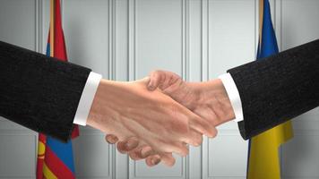 Mongolia and Ukraine diplomacy deal 3D illustration. Businessman partner handshake. National flag on background photo