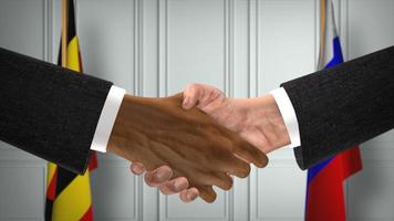 Uganda and Russia deal handshake, politics 3D illustration. Official meeting or cooperation, business meet. Businessmen or politicians shake hands photo