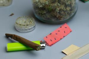 Cannabis smoking accessories business shop. Marjuana legal industry concept. Blunt full of weed photo