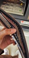 Portrait of hundreds of thousands of rupiah bills in the wallet photo