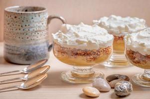 Three individual servings of the Norwegian dessert Veiled Peasant Girls. photo