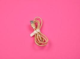 twisted golden cable for charging with electricity equipment photo