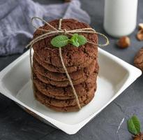 stack of round chocolate biscuits tied with a rope photo