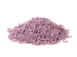 pile of pressed purple cat litter isolated on white background. Granules with lavender scent photo