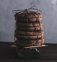 stack of round chocolate cookies tied with a rope photo