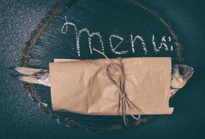 Fish ram is wrapped in brown kraft paper photo
