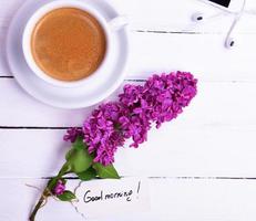 Black coffee in a white cup with a saucer photo