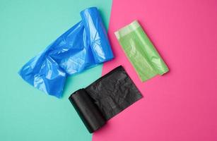 three rolled up rolls with plastic garbage bags photo