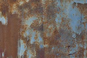 textura pintada de azul con corrosión de metal marrón foto