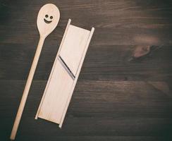 wooden spoon and wooden grater for vegetables photo